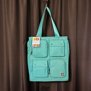 NWT. Bright, Teal, LEGO travel bag.